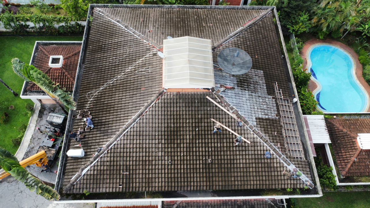 Roof before renovation — worn tile roof
